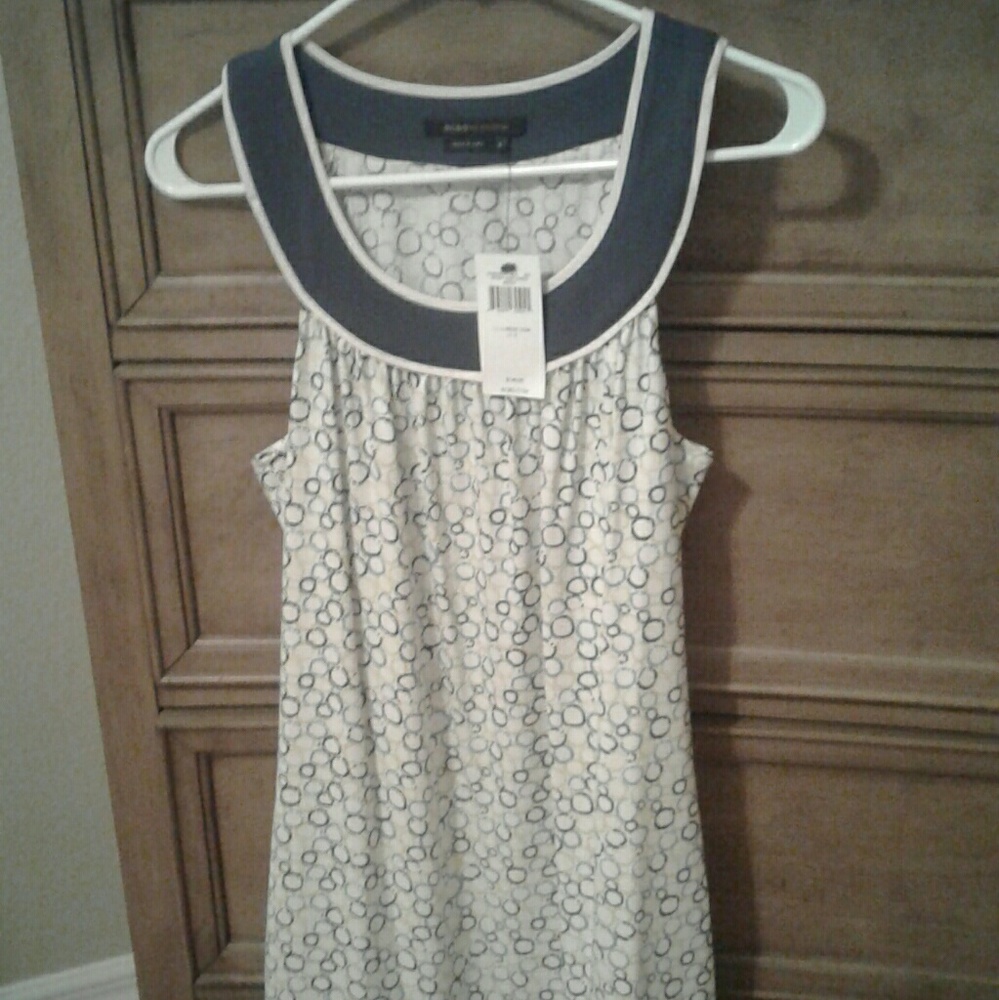 Sleeveless, round color dress by BCBG. It's an A
